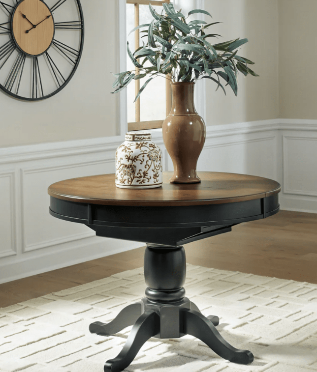 AshleyAshley PCD619 Clorazi - Oval Dining Room Butterfly Extension Table - Black / Brown