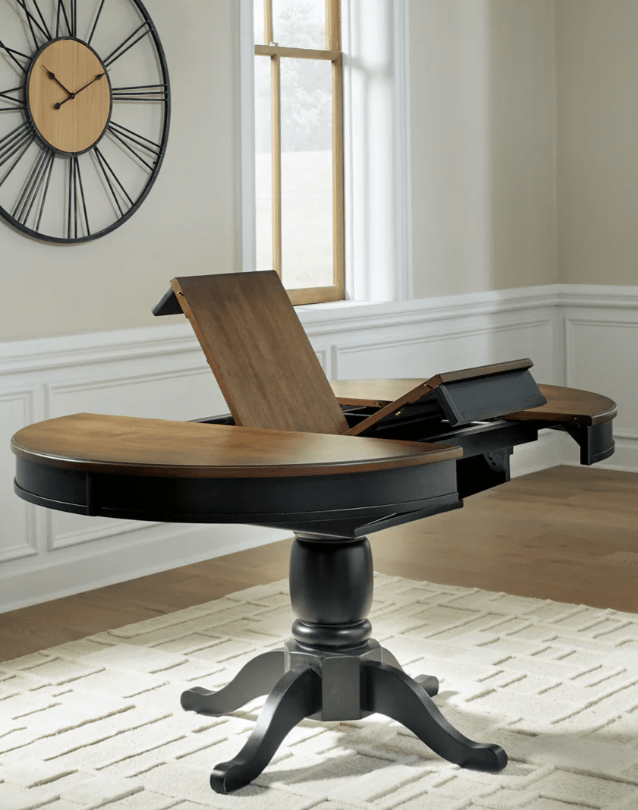 AshleyAshley PCD619 Clorazi - Oval Dining Room Butterfly Extension Table - Black / Brown