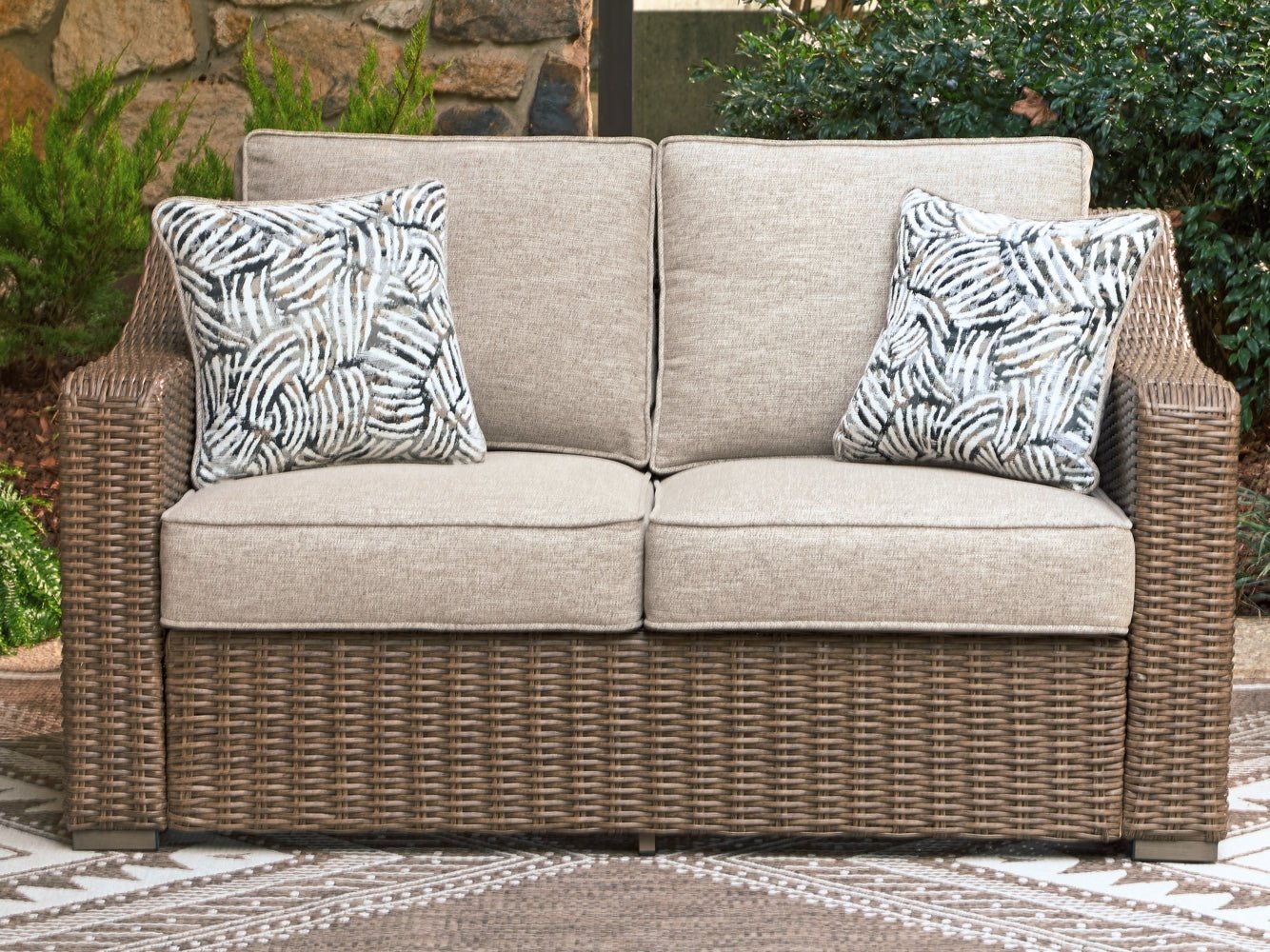 AshleyLaguna Heights Outdoor Loveseat with Cushion