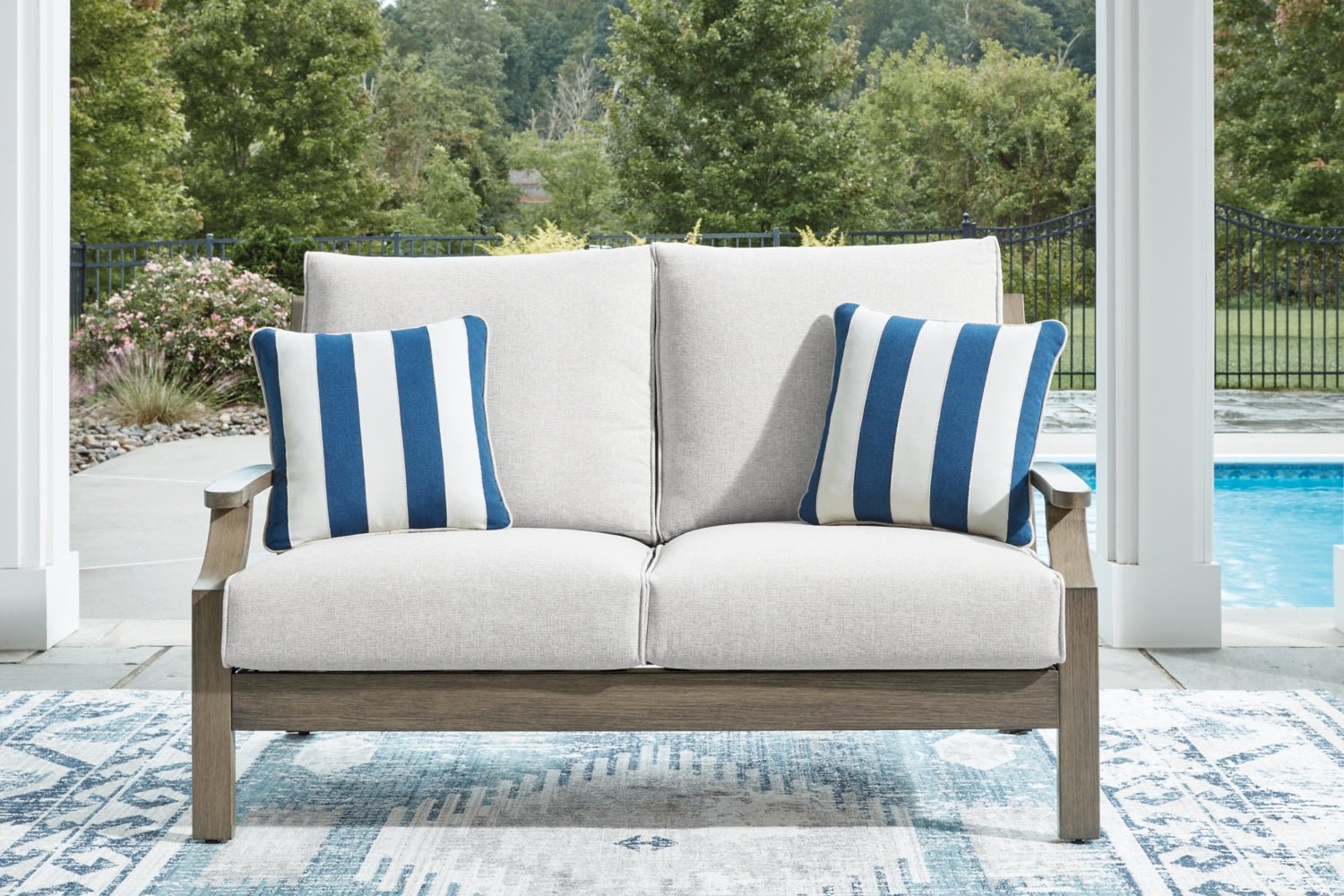 AshleyRainier Ranch Outdoor Sofa and Loveseat with Coffee Table